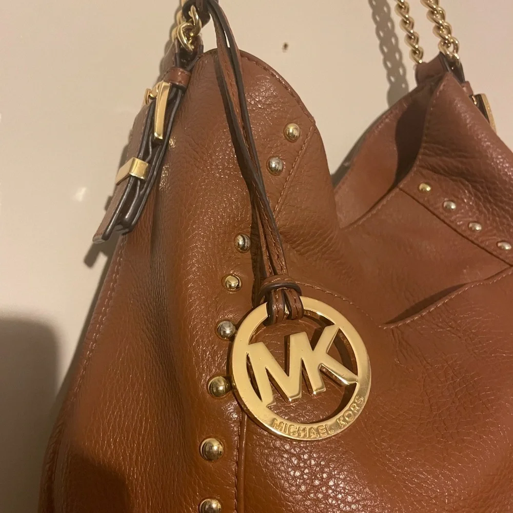 Michael Kors cognac pebbled leather hobo bag w hang tag